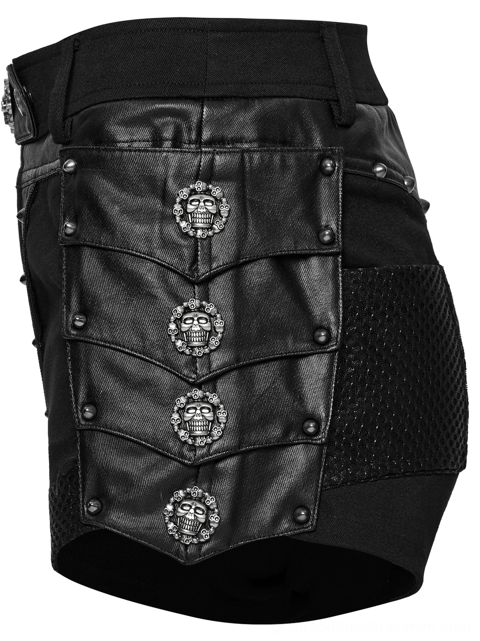 Side-back flat lay of black gothic studded shorts showing tiered leather skull buckles, rivets, mesh side pocket, and layered construction details