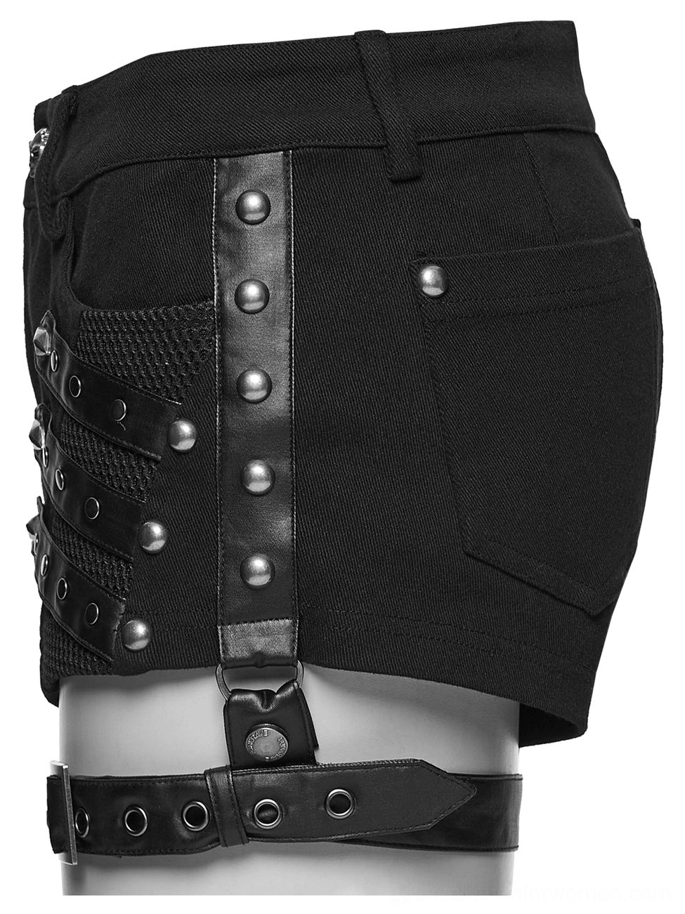 Side three-quarter view of studded leather black shorts with mesh panel, detachable leg harness with D-ring hardware