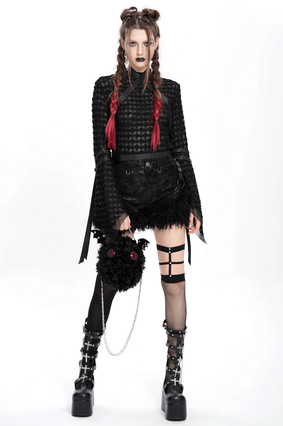 Thigh detail of gothic black shorts showing harness strap placement and faux leather quality finish