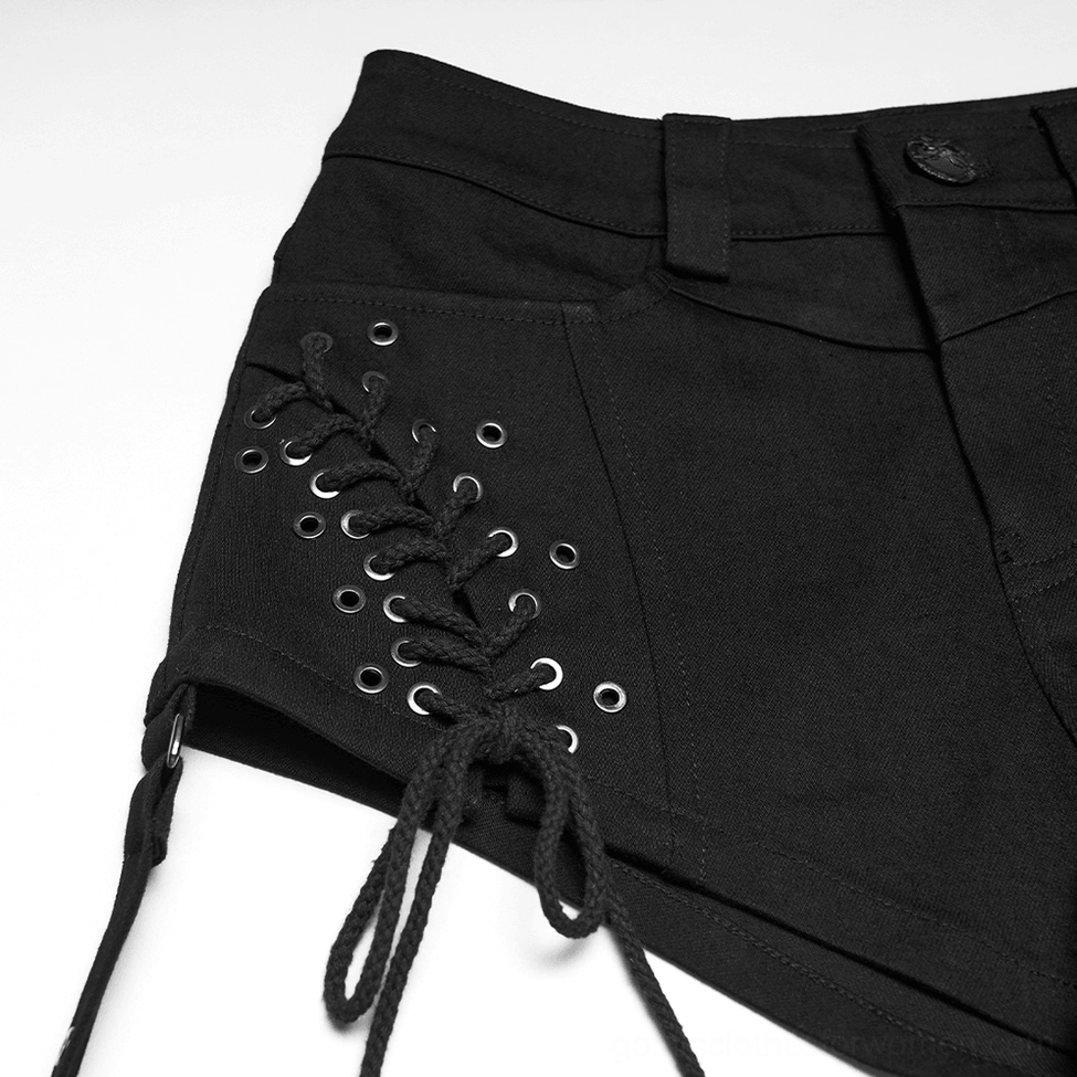 Close-up detail shot of black gothic shorts waist area showing lace-up and denim fabric quality