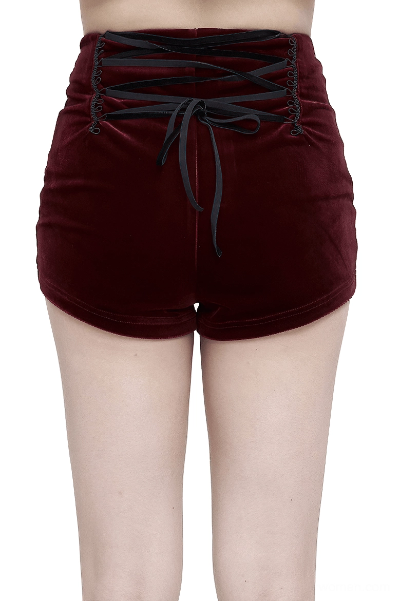 Back view of wine red gothic shorts showing crisscross lace-up back design with decorative bow tie