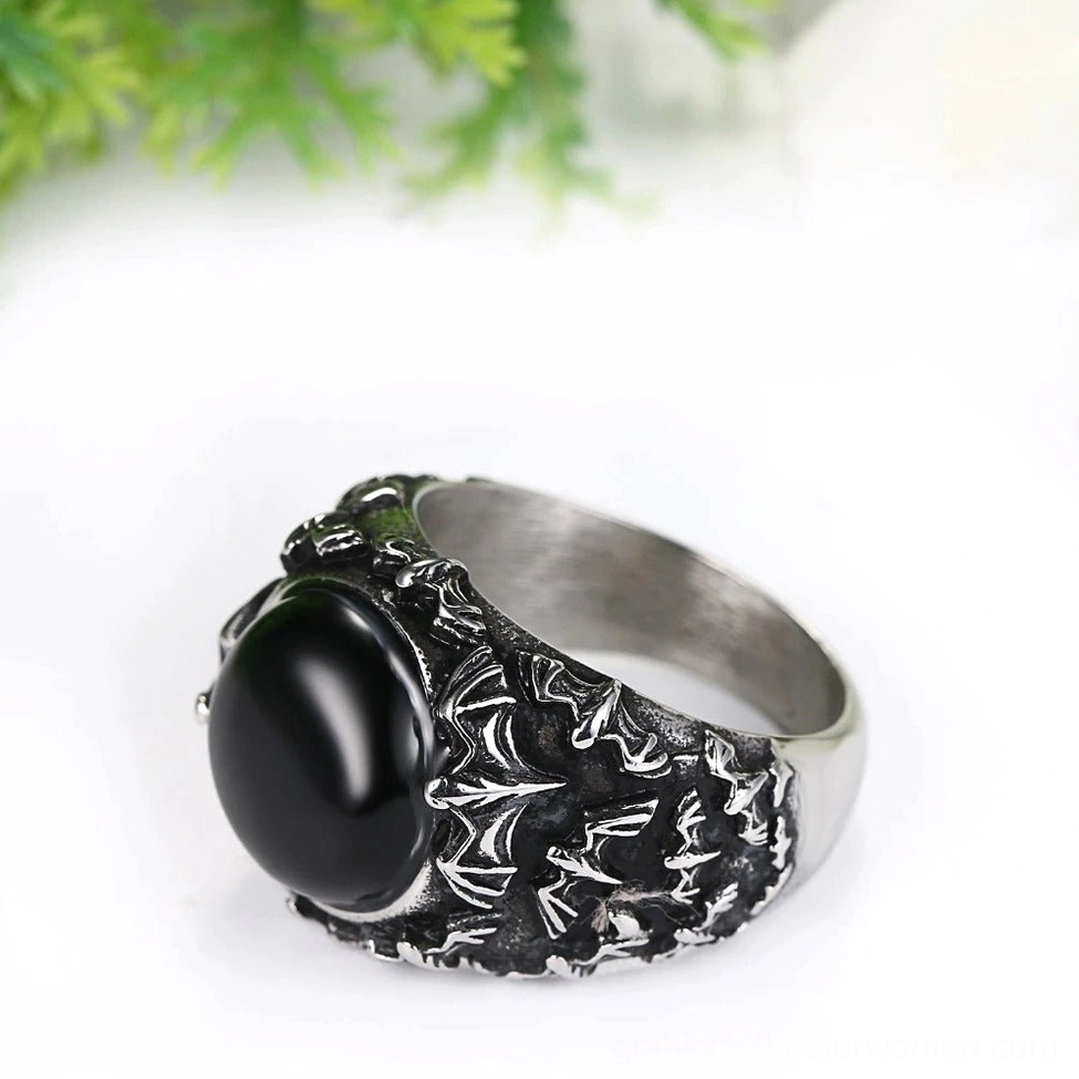 Gothic black stone signet ring three-quarter side perspective with matte silver band and antiqued exterior