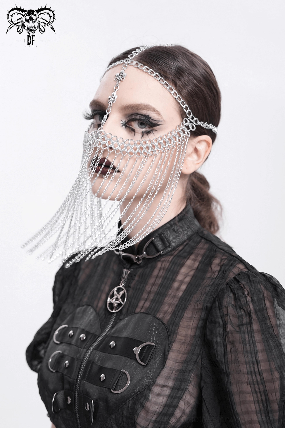 Silver chain gothic face veil headpiece worn by model with dramatic goth makeup, three-quarter front angle