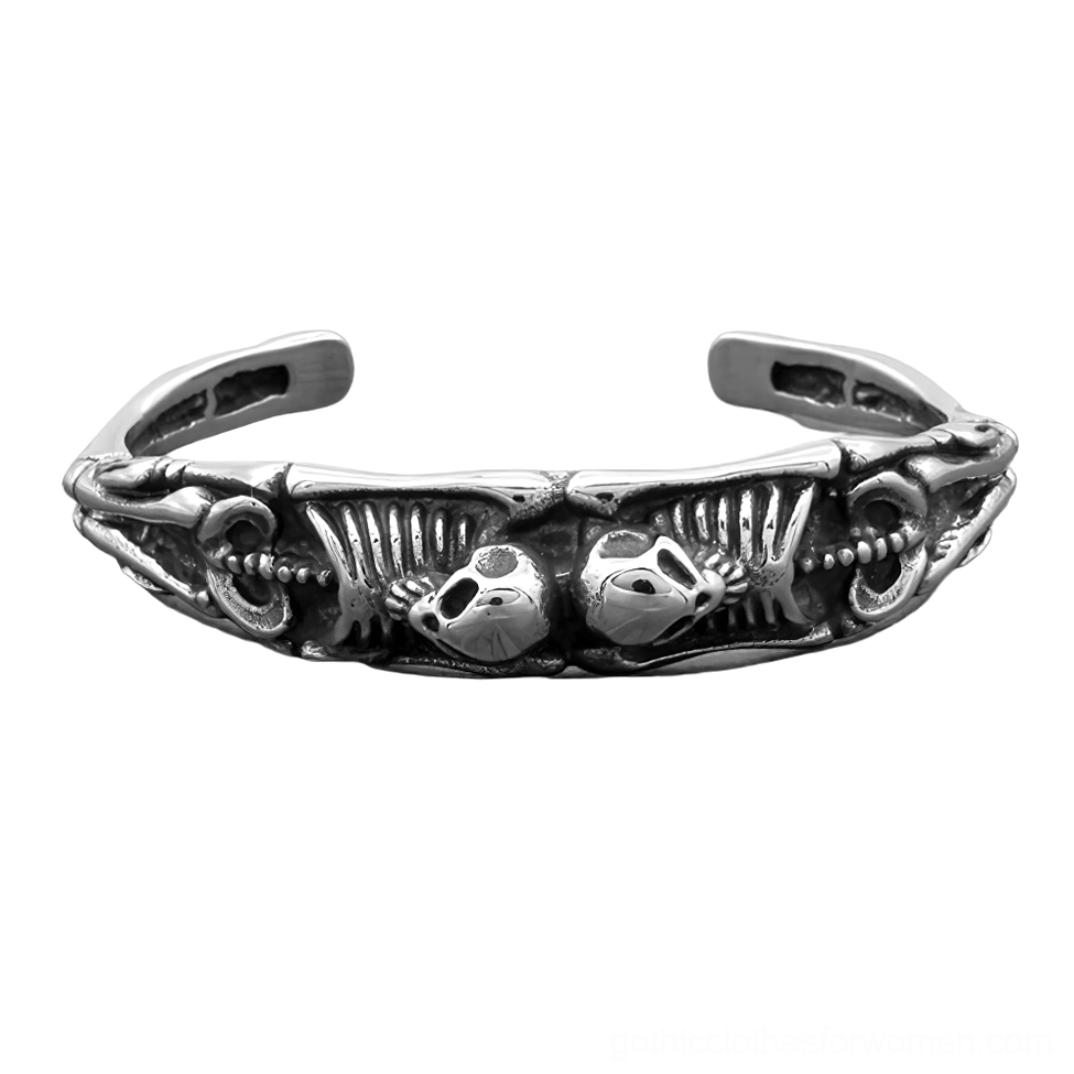 flat lay gothic skeleton cuff bracelet showing rib cage and skull engraved pattern overhead
