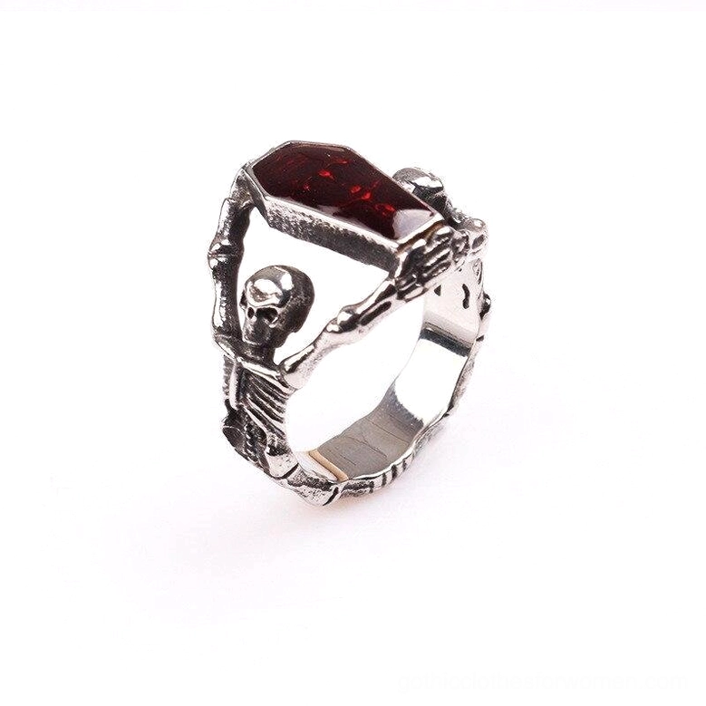 Gothic skeleton coffin ring featuring hollow carved skeleton design with red coffin-shaped rhinestone, 3/4 side angle photography