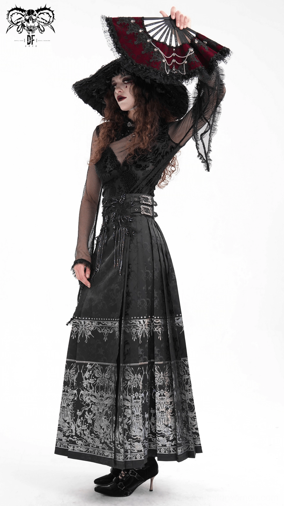 Back view detail of black gothic maxi skirt showcasing embroidered waistband trim and high-waisted construction on jacquard fabric