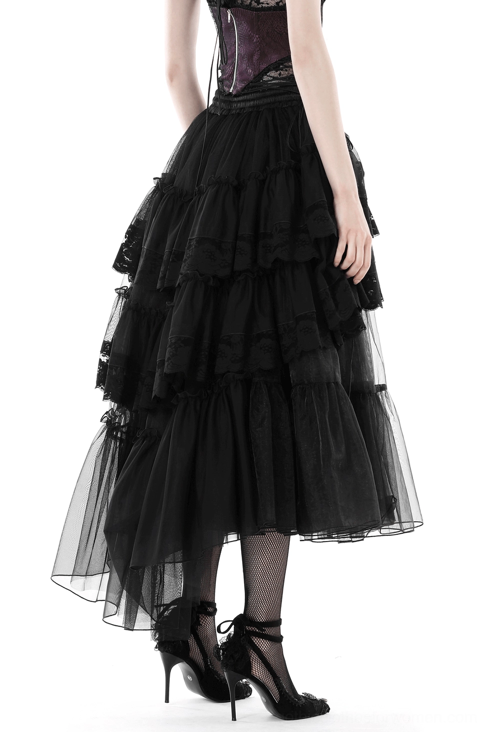 Black layered tulle gothic skirt back view showing dramatic tiered ruffles and high-low asymmetrical hem on model