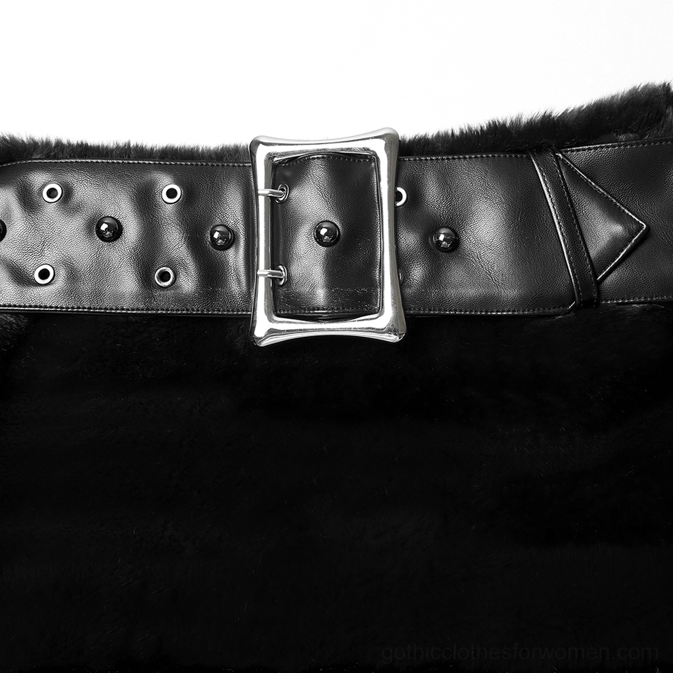 Close-up macro detail of black gothic skirt studded leather belt with silver hardware and precise stud pattern