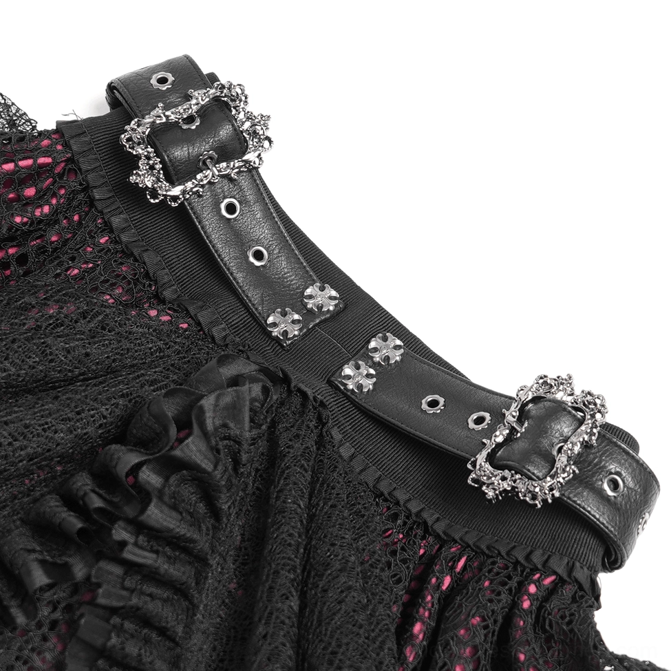 Close-up detail of ornate silver gothic buckles and black leather statement belt strap