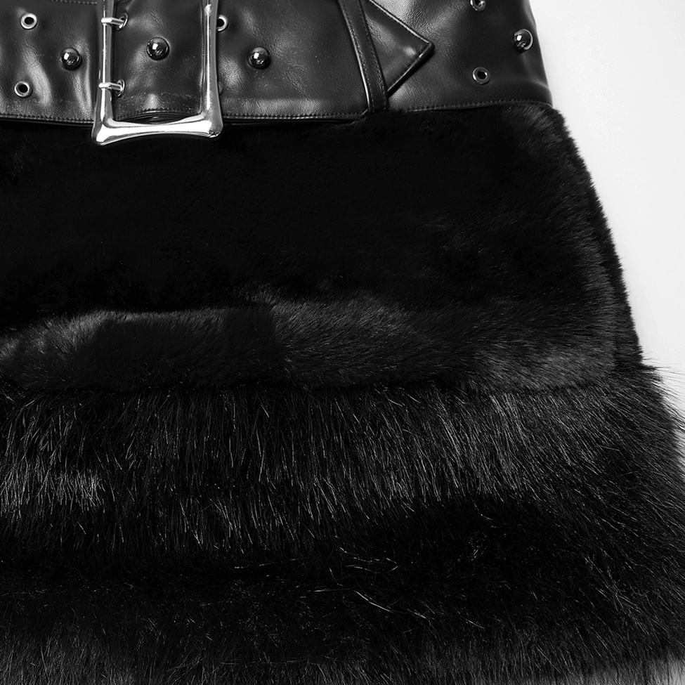 Close-up macro detail showing connection between studded leather belt and black faux fur fabric, demonstrating construction quality