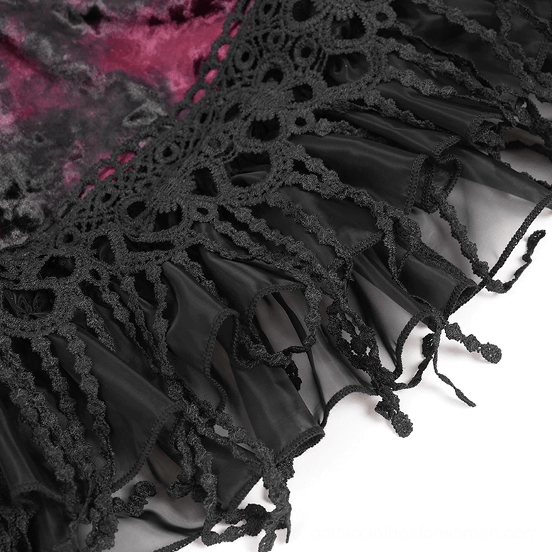 Close-up detail of black crochet lace fabric with sheer tulle underlayer on gothic skirt