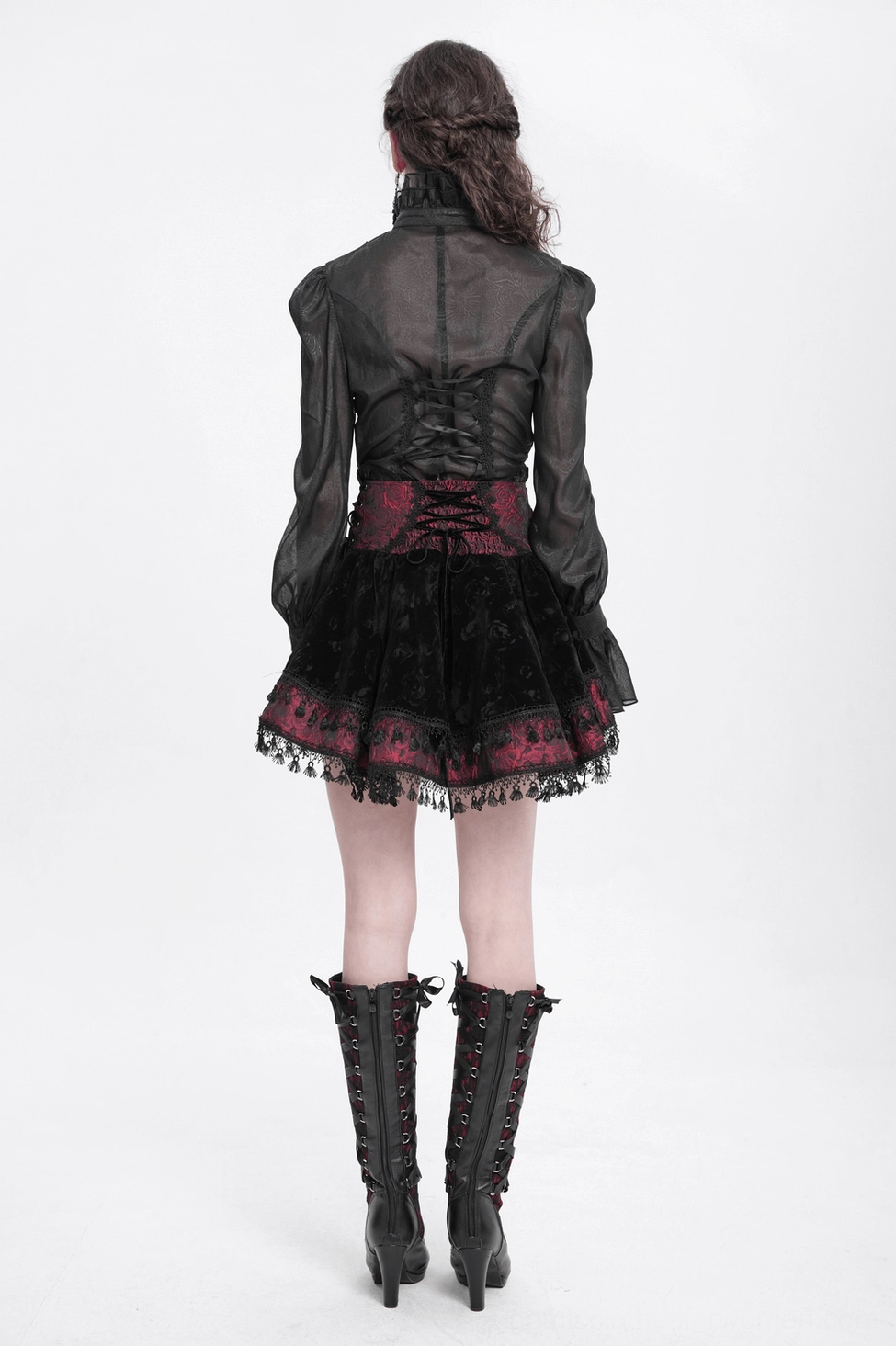 Gothic lace-up velvet skirt front close-up showing corset waist ties and lace-up closure mechanism