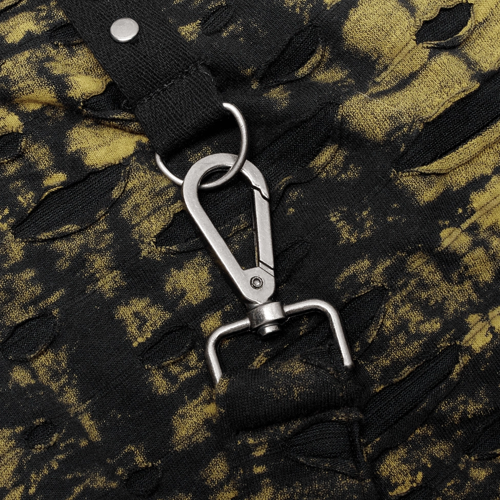 Close-up detail shot of gothic distressed skirt eyelet strap hardware with metal rivets and grommets on tie-dye knit