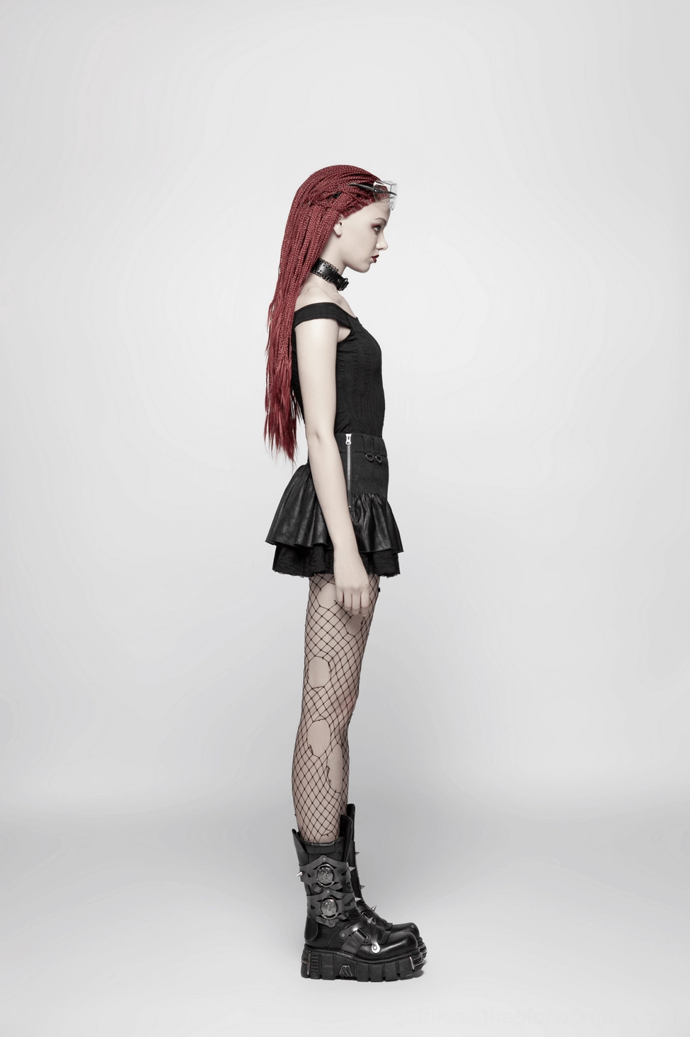Black gothic mini skirt detail showing polyester linen viscose blend fabric and industrial edge aesthetic