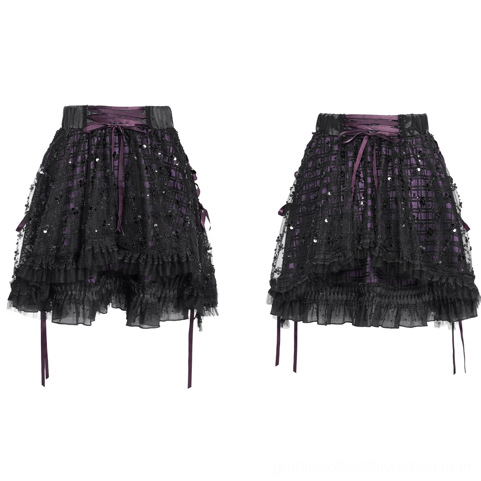 Gothic purple tulle skirt flat lay displaying high waist satin band, hanging side ribbons, and layered plaid and sequin construction