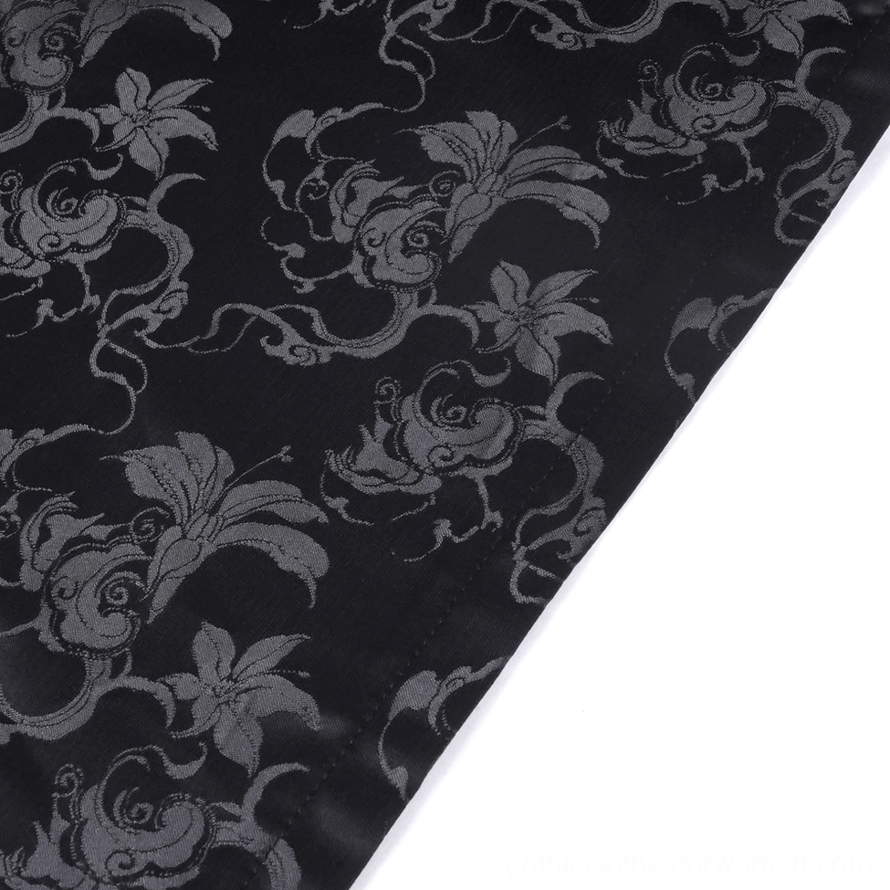 Front close-up detail of black gothic maxi skirt showing silver embroidery patterns and beaded decoration on jacquard fabric