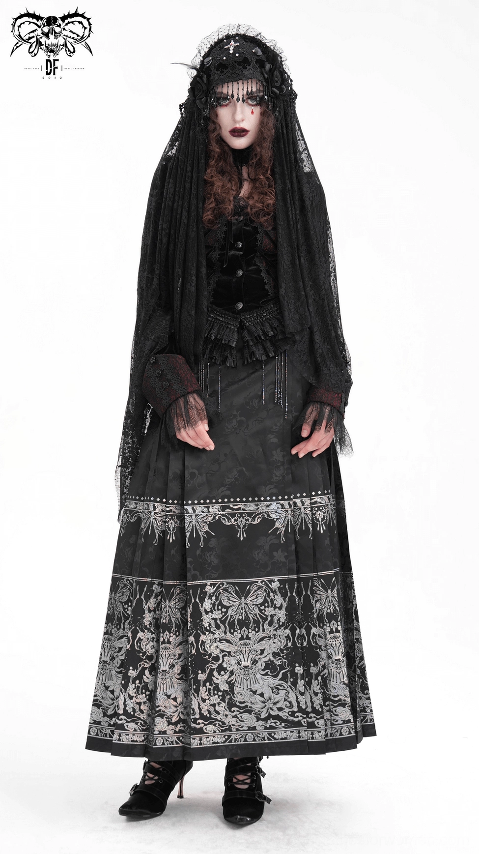 Black gothic maxi skirt front waist detail showing metal buckles, tassel elements and beaded lace appliqué on fitted waistband