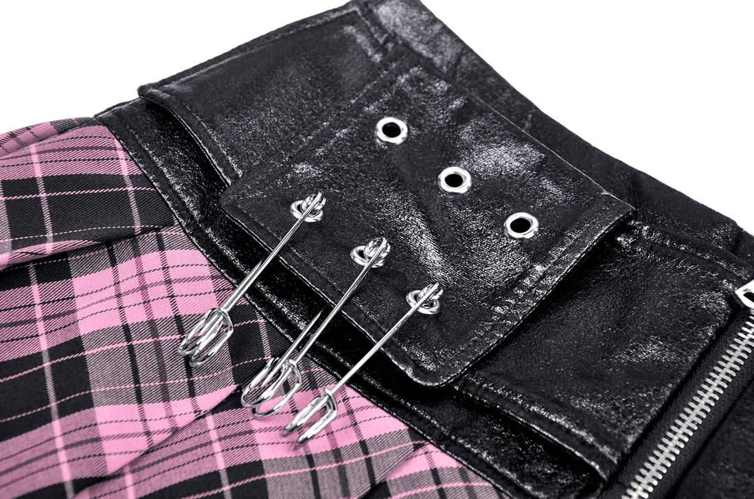 Black-pink plaid gothic skirt waistband close-up showing multiple grommet holes and leather material