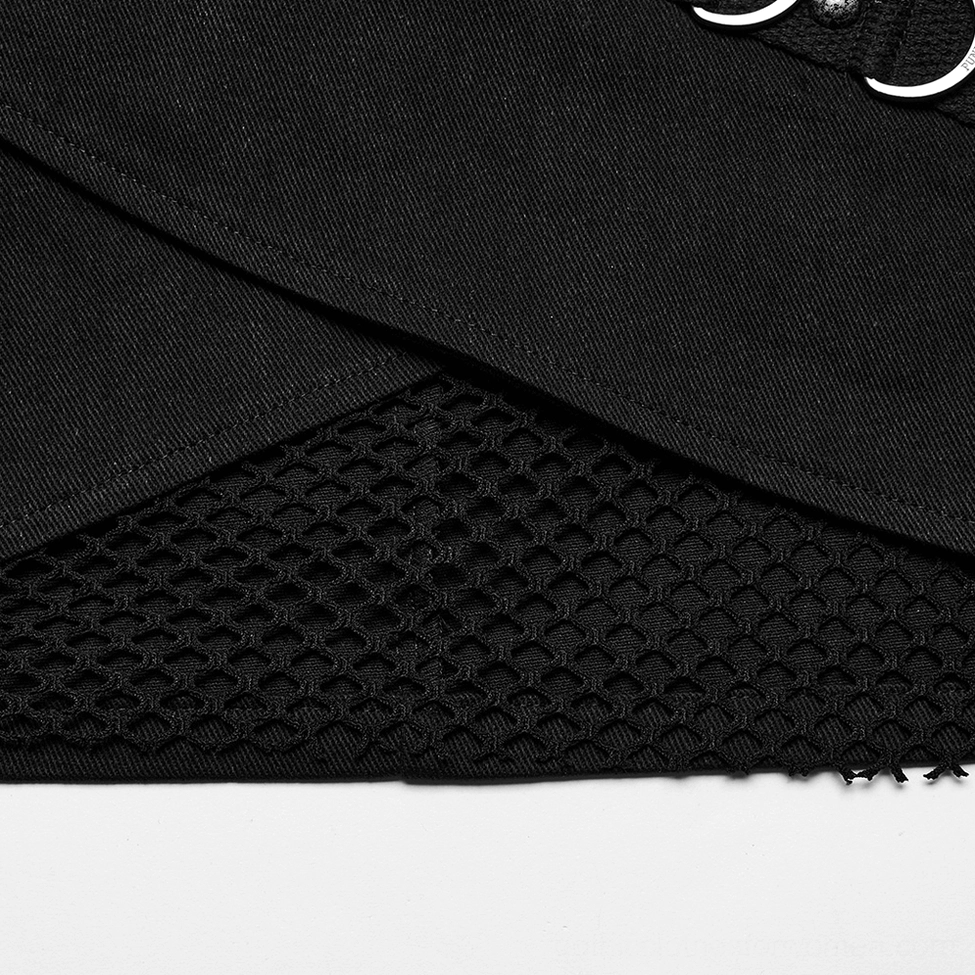 Close-up detail of black gothic skirt hem showing fishnet underlayer, wrap fabric and distressed edges