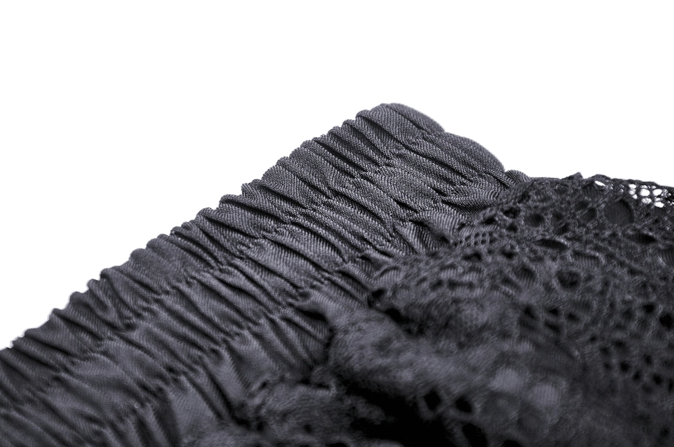Black ruffled gothic skirt construction detail highlighting layered lace craftsmanship and durability