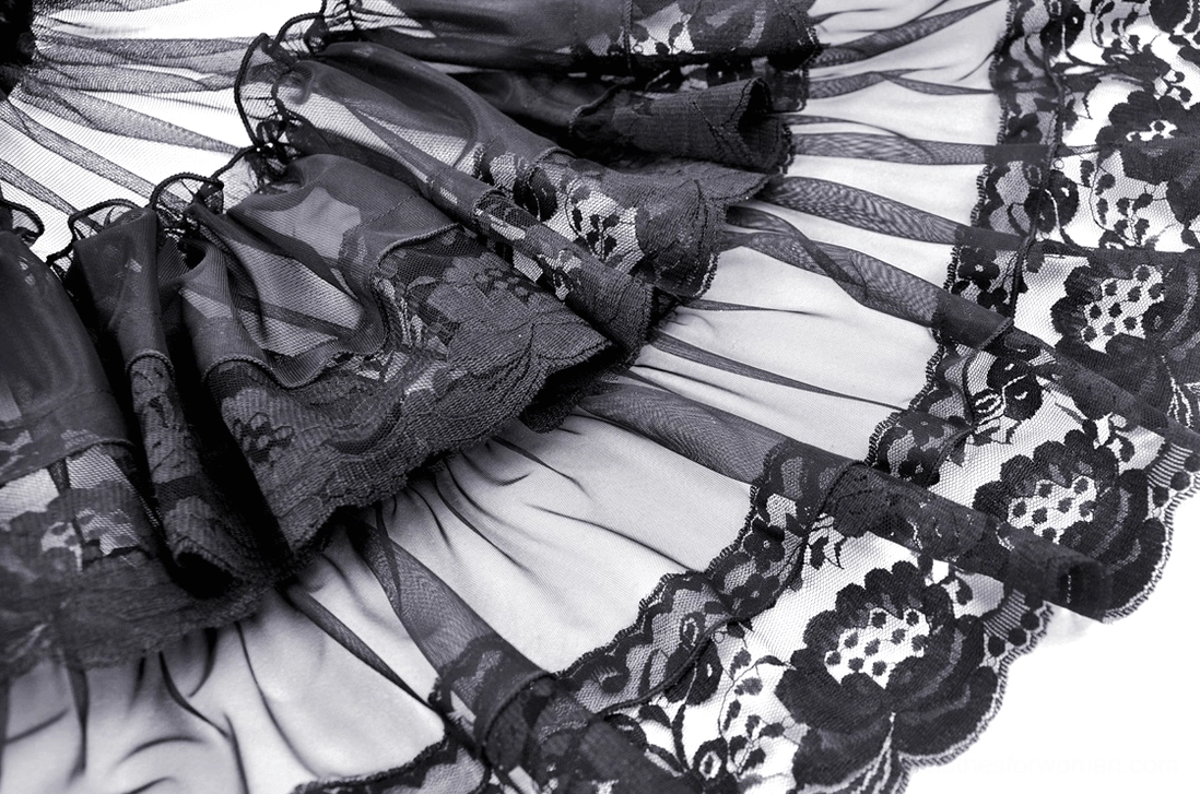 Detailed view of gothic lace and sheer tulle ruffle layers showing floral lace trim and fabric mix