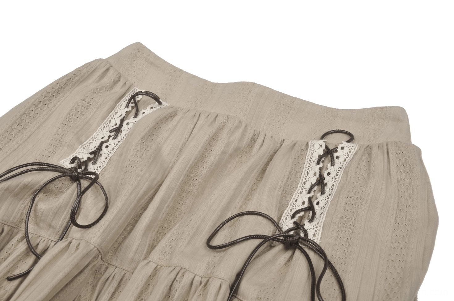 Close-up detail of gothic skirt waist area with leather lace-up bows, ornate lace trim, and textured woven cotton fabric