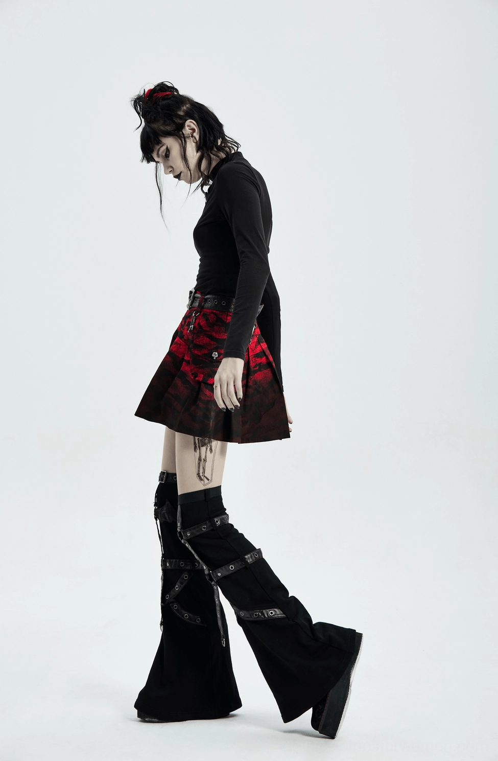 Detail shot of gothic skirt's metal lobster buckle, PU leather loop, and waist bag attachment mechanism