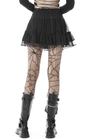 Gothic black mini skirt with tiered mesh design and skull chain, worn with fishnet tights and combat boots, rear view