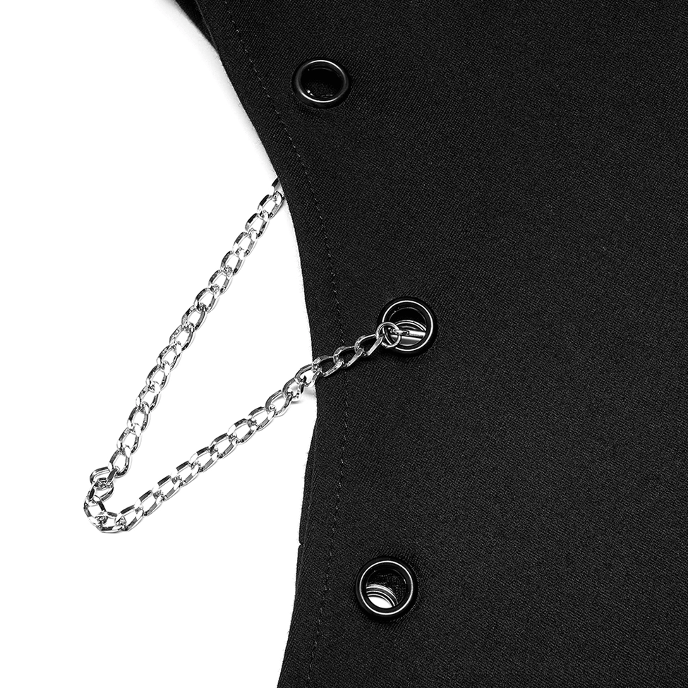 Close-up of silver metal chain and black metal button hardware on gothic asymmetric skirt