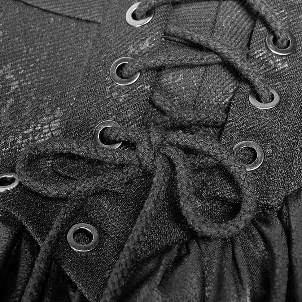 Close-up of black gothic skirt metal eyelet waistband and braided lace tie detail on cracked fabric