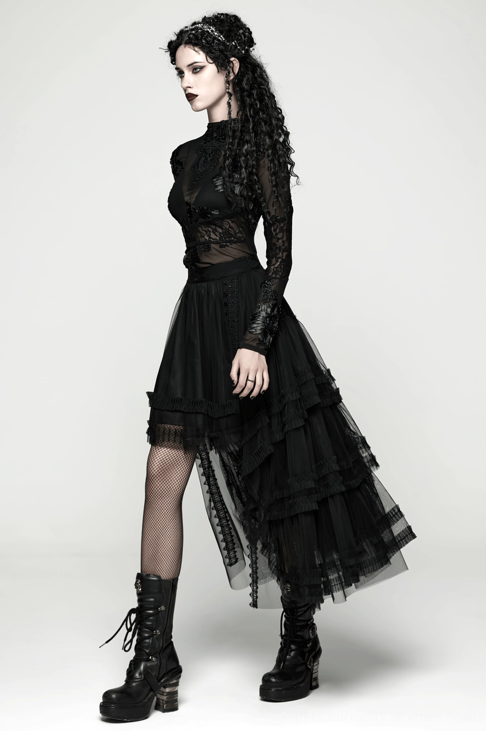 Black gothic high-low mesh skirt worn with platform boots demonstrating alternative fashion versatility and style
