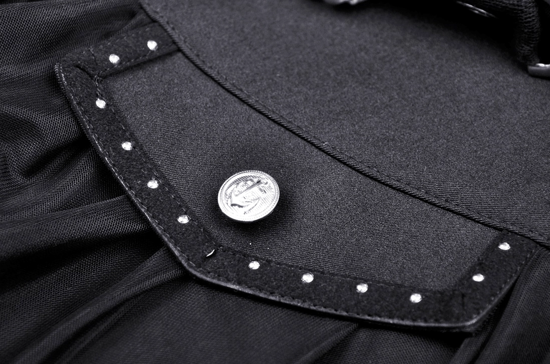 Decorative pocket trim detail of gothic skirt featuring round metal buttons and metal studs on black fabric