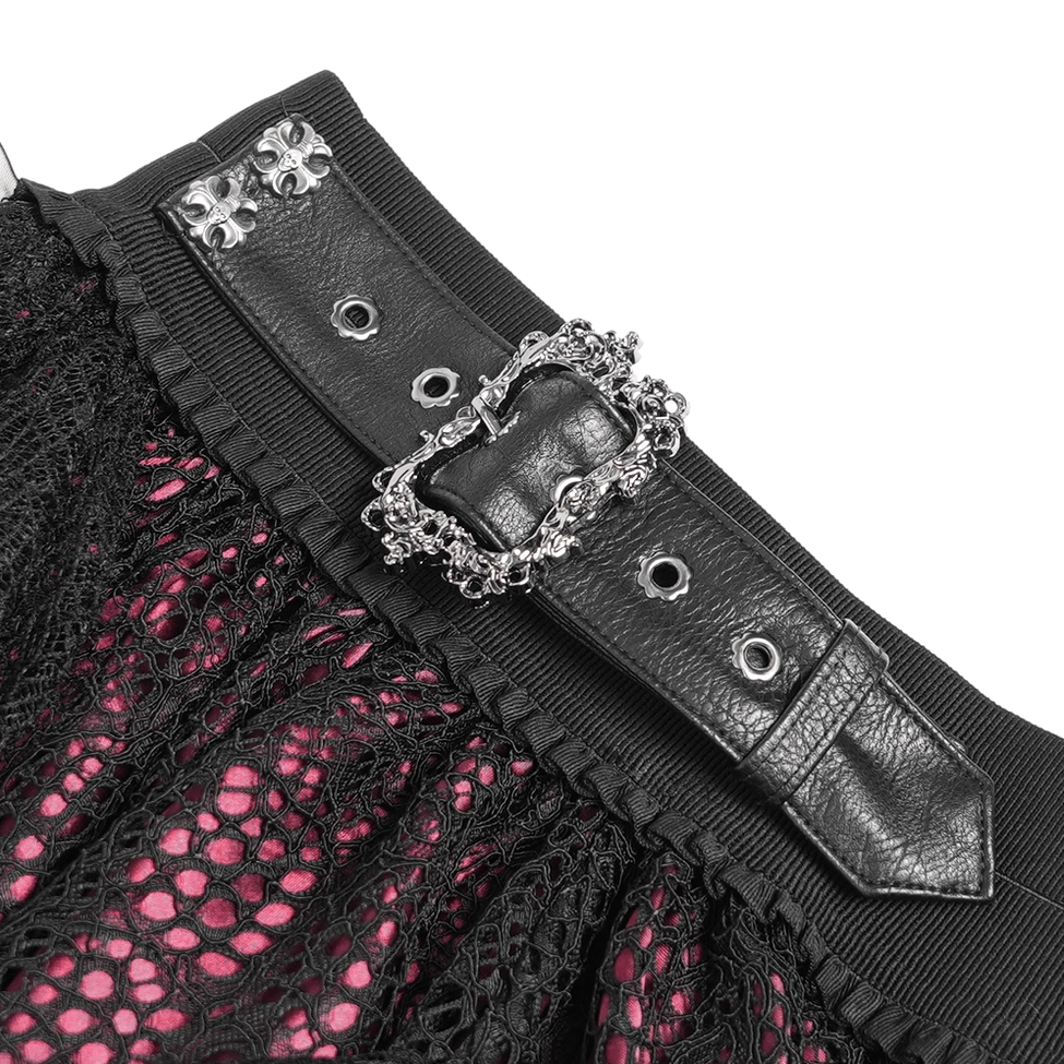 Detailed view of red lace inner layer and metal gothic buckles on black lace skirt
