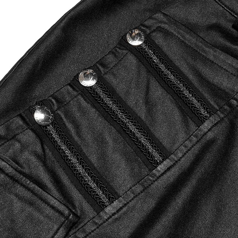 Close-up detail of silver round rivets and decorative zipper trims on black faux leather gothic skirt