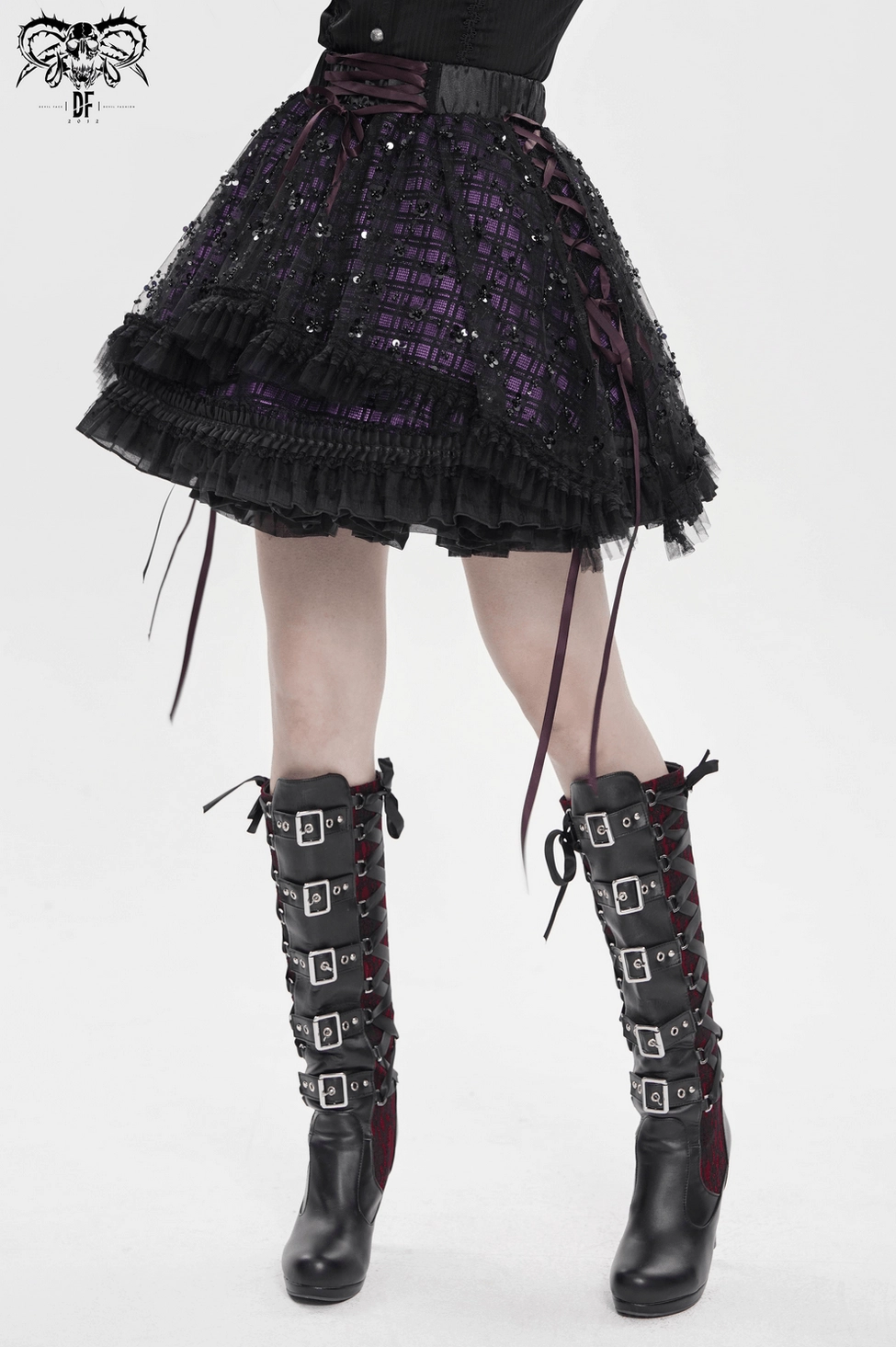 Gothic skirt detailed view of ruffled hem and asymmetrical cut creating movement and soft romantic elements characteristic of dark fashion