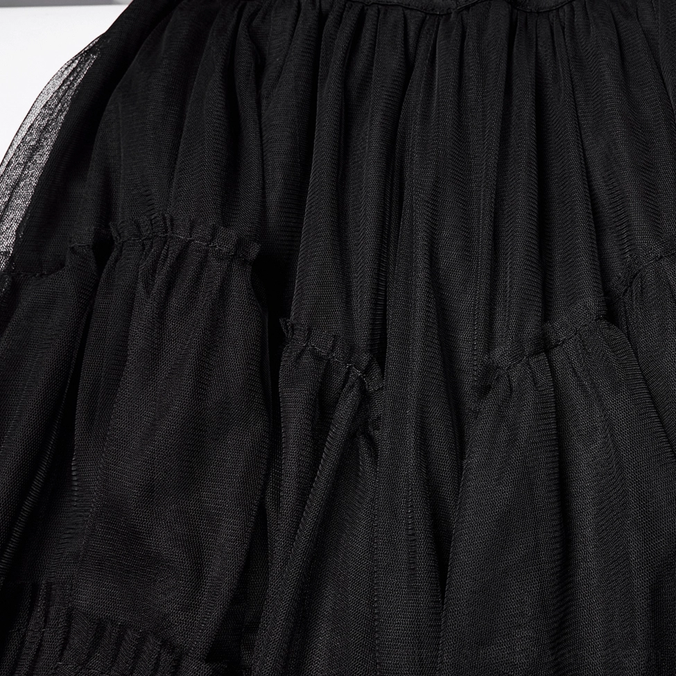 Black gothic mesh skirt ruffled tulle panel close-up detail showing gathered layers and precision stitching