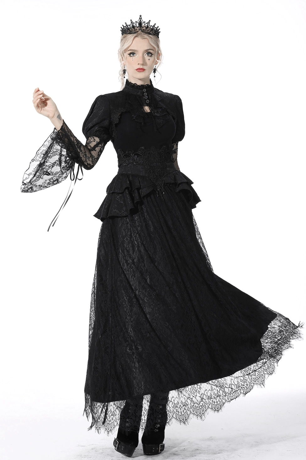 Black lace maxi skirt detail showing scalloped lace hem and ruffled peplum waist construction