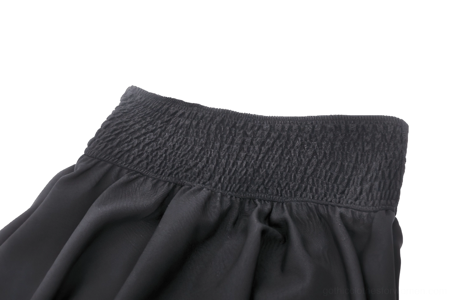 Close-up of gothic black skirt smocked elastic waistband attached to flared portion