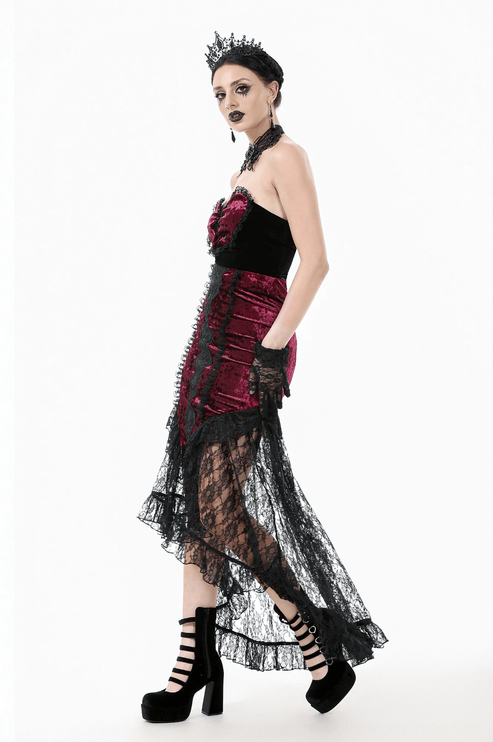 Styled presentation of burgundy velvet gothic skirt with coordinating accessories and alternative fashion aesthetic