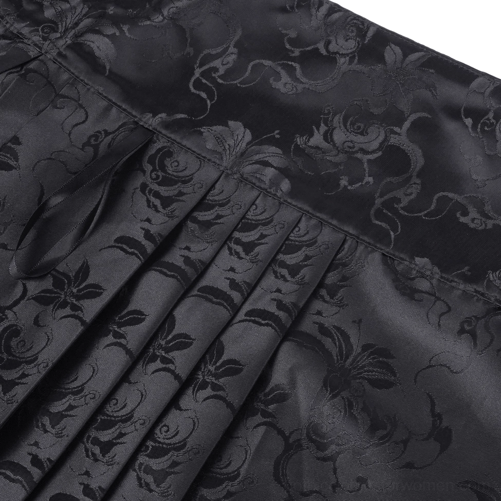 Textured close-up view of black gothic skirt emphasizing intricate embroidery work, beaded elements and premium material quality