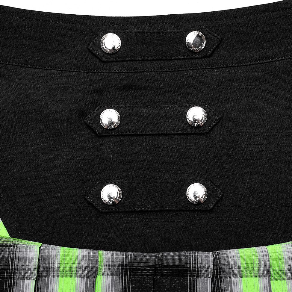 Close-up macro detail of triple silver snap button straps on black-green tartan gothic skirt