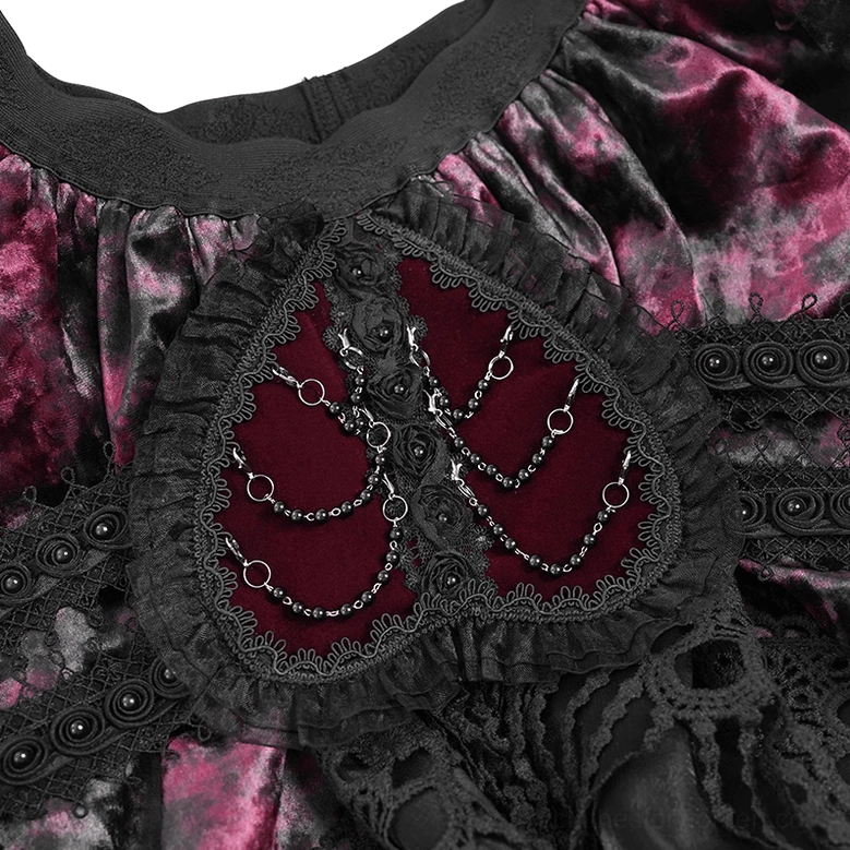Fabric texture detail of wine red crushed velvet with black lace overlay on gothic mini skirt