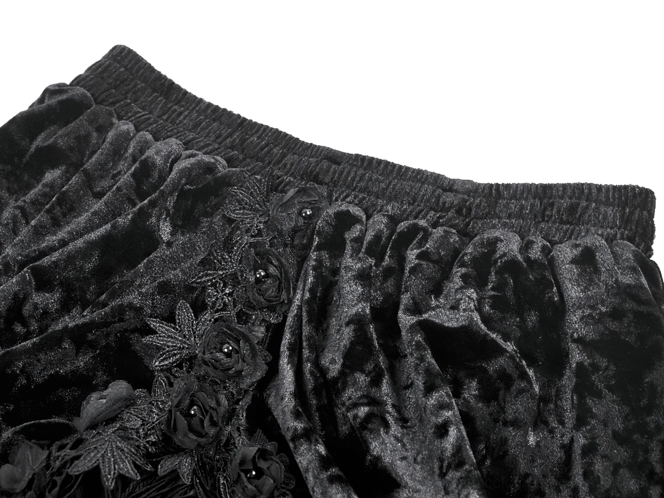 Close-up detail of gothic skirt waistband showing elastic construction, crushed velvet fabric, and floral lace appliqué embroidery
