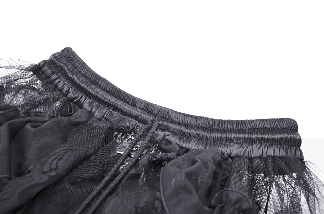 Close-up detail of gothic skirt waistband showing zipper closure and elasticated mesh with woven fabric backing