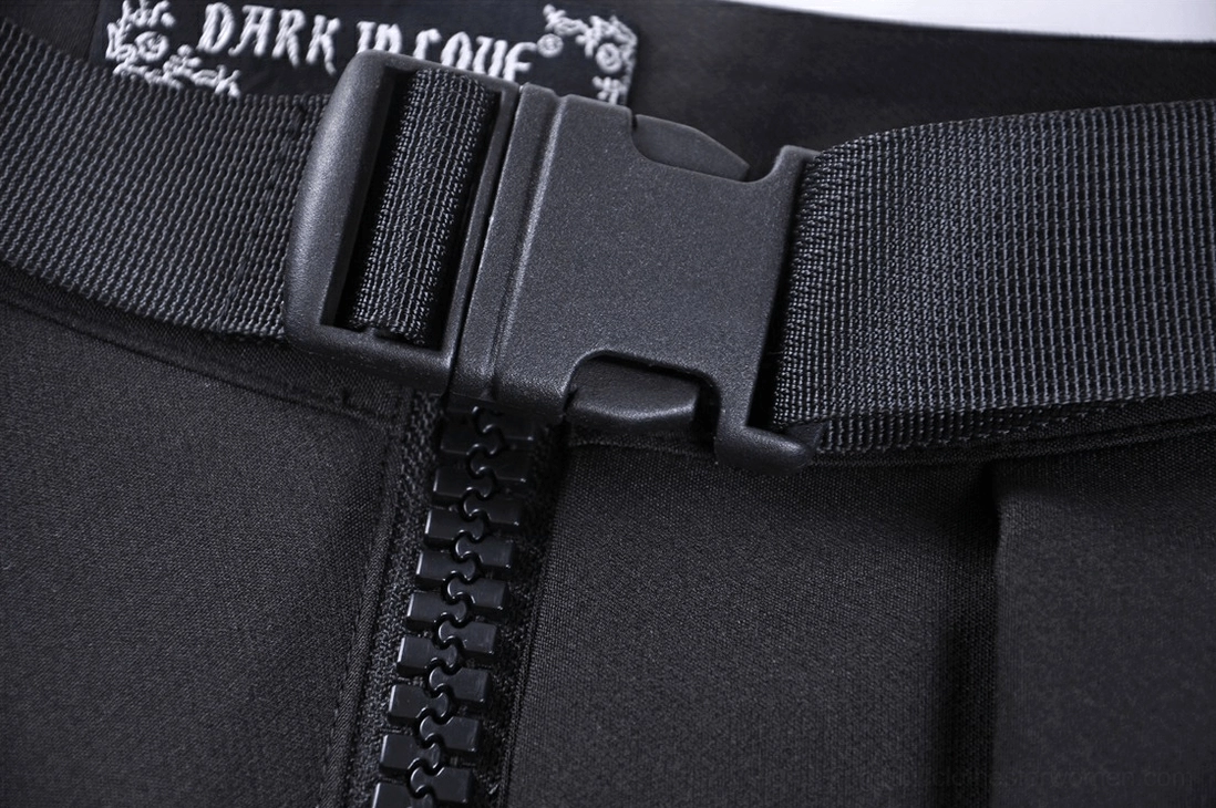 Gothic pleated mini skirt zipper fastener close-up detail showing metal teeth and black woven belt