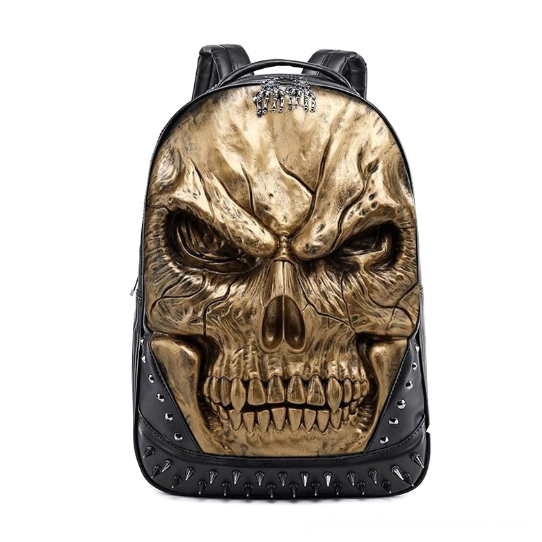 Gold 3D embossed skull gothic backpack with matte black base and spike embellishments, luxury alternative fashion