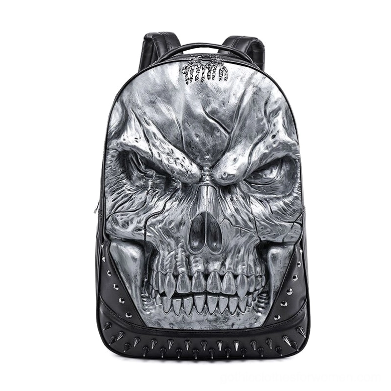 Silver 3D skull backpack with top charm and spike trims, industrial gothic design from three-quarter view