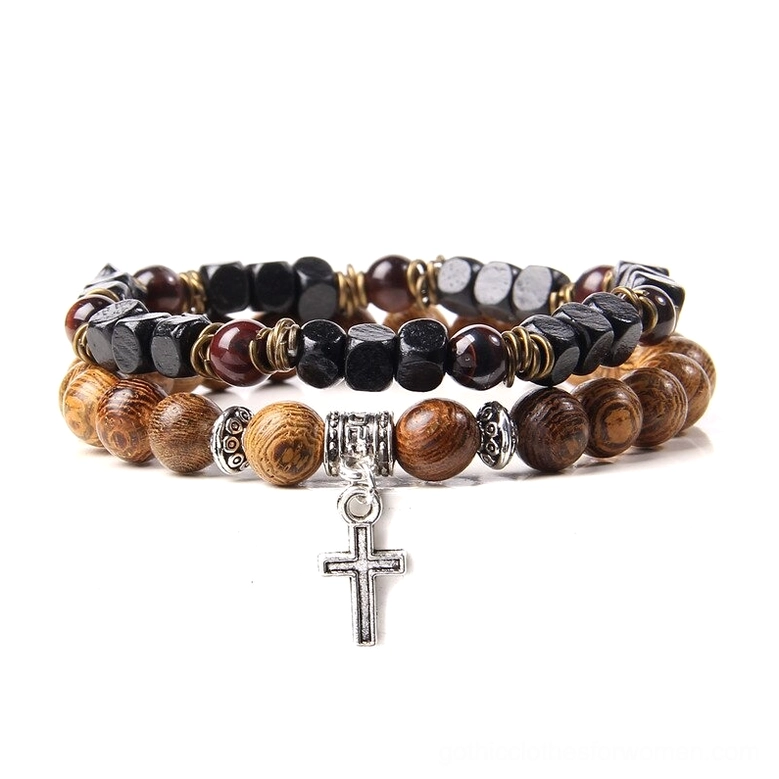 Stacked gothic beaded bracelets featuring black and brown stone beads with silver skull charm detail, close-up shot