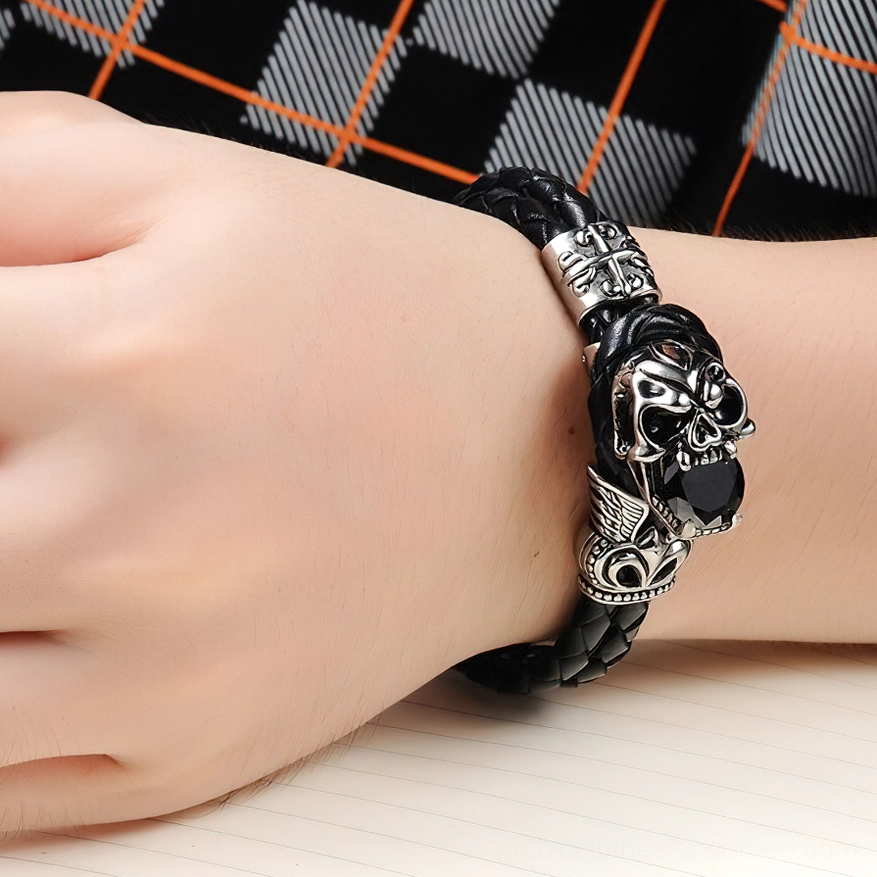 Gothic skull charm bracelet worn on male wrist, side close-up view demonstrating fit and styling on the body