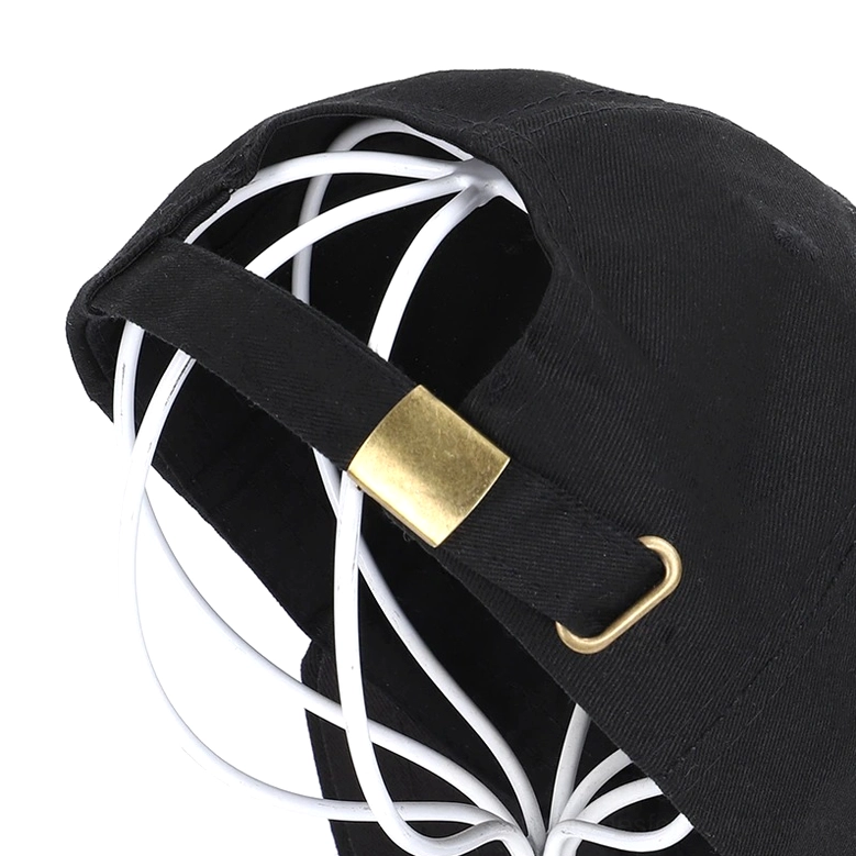 Close-up detail of adjustable gold metal buckle on gothic skull baseball cap back strap